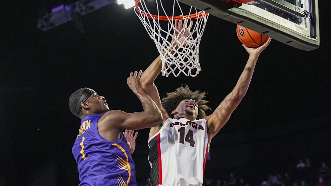 Nov 4, 2024; Athens, Georgia, USA; Georgia Bulldogs forward Asa Newell (14) shoots over Tennessee Tech Golden Eagles guard Mekhi Cameron (1) during the first half at Stegeman Coliseum. Mandatory Credit: Dale Zanine-Imagn Images