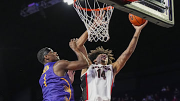 Nov 4, 2024; Athens, Georgia, USA; Georgia Bulldogs forward Asa Newell (14) shoots over Tennessee Tech Golden Eagles guard Mekhi Cameron (1) during the first half at Stegeman Coliseum. Mandatory Credit: Dale Zanine-Imagn Images