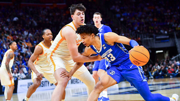 Tennessee forward J.P. Estrella (13) defends Creighton guard Trey Alexander (23) during a NCAA Tournament Sweet 16 game between Tennessee and Creighton held at Little Caesars Arena in Detroit on Friday, March 29, 2024.