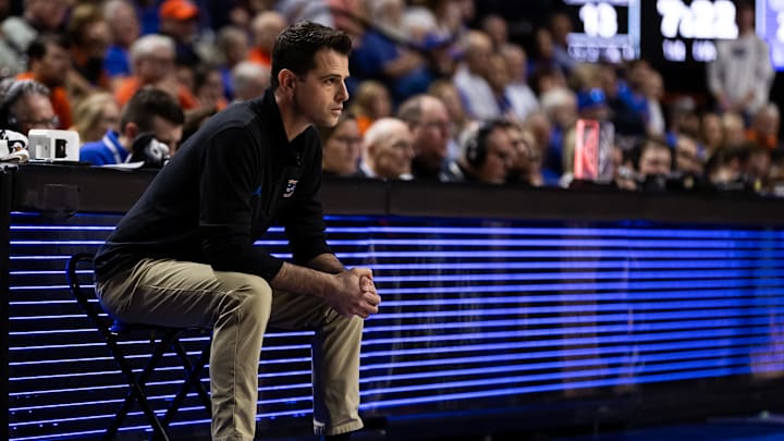 Feb 24, 2024; Gainesville, Florida, USA; Florida Gators head coach Todd Golden looks on while seated