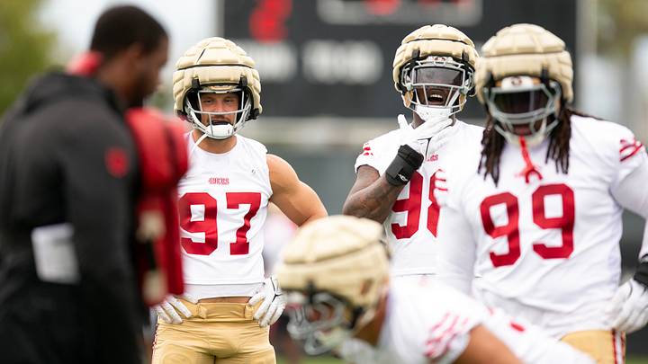 Santa Clara, CA, USA; San Francisco 49ers defensive ends Nick Bosa (97)  and Mykel Williams (98) watch their teammates during pass rushing drills on the second day of training camp. Mandatory Credit: D. Ross Cameron-Imagn Images