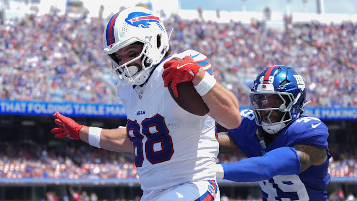 Aug 9, 2025; Orchard Park, New York, USA; Buffalo Bills tight end Dawson Knox (88) reacts to scoring a touchdown against New York Giants linebacker Chris Board (49)