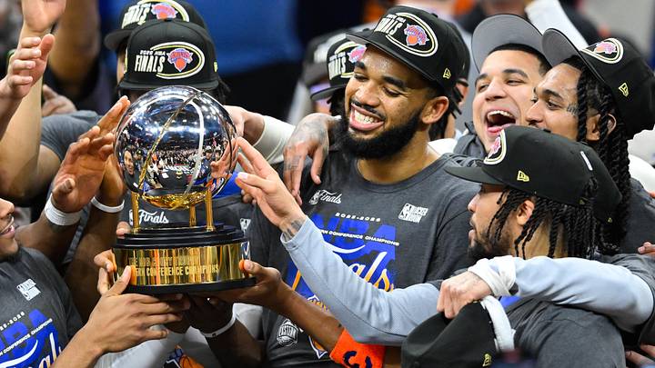 May 25, 2026; Cleveland, Ohio, USA; New York Knicks center Karl-Anthony Towns (32) lifts the 2026 Eastern Conference trophy after defeating the Cleveland Cavaliers in game four of the eastern conference finals for the 2026 NBA playoffs at Rocket Arena. Mandatory Credit: David Richard-Imagn Images
