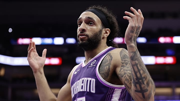 Feb 19, 2026; Sacramento, California, USA; Sacramento Kings guard Devin Carter (22) gestures to the Orlando Magic bench to acknowledge the foul he committed during the third quarter at Golden 1 Center. Mandatory Credit: Kelley L Cox-Imagn Images