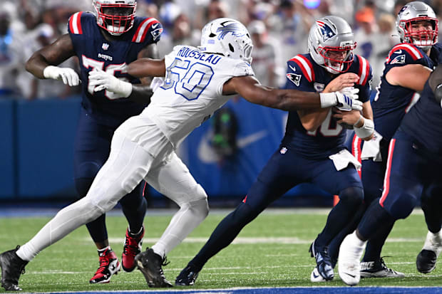 Buffalo Bills defensive end Greg Rousseau sacks New England Patriots quarterback Drake Maye.