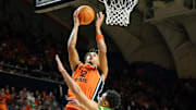 Oregon State forward Michael Rataj goes up for a shot under coverage from Oregon guard Jackson Shelstad as the Oregon State Beavers host the Oregon Ducks Thursday, Nov. 21, 2024 at Gill Coliseum in Corvallis, Ore.