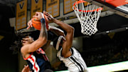 Feb 22, 2025; Nashville, Tennessee, USA; Vanderbilt Commodores guard MJ Collins Jr. (2) and Mississippi Rebels guard Dre Davis (14) fight for the rebound during the first half at Memorial Gymnasium. Mandatory Credit: Steve Roberts-Imagn Images
