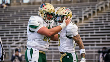 Nov 1, 2025; East Hartford, Connecticut, USA; UAB Blazers wide receiver Kaleb Brown (5) is congratulated after scoring a touchdown against the UConn Huskies in the second half at Pratt & Whitney Stadium at Rentschler Field. Mandatory Credit: David Butler II-Imagn Images