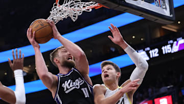 Oct 15, 2024; Salt Lake City, Utah, USA; Sacramento Kings forward Domantas Sabonis (11) and Utah Jazz center Walker Kessler (24) play for a rebound during the fourth quarter at Delta Center. Mandatory Credit: Rob Gray-Imagn Images