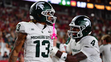 Sep 20, 2025; Los Angeles, California, USA; Michigan State Spartans wide receiver Chrishon McCray (13) celebrates his touchdown scored against the against the Southern California Trojans with linebacker Marcellius Pulliam (4) during the first half at the Los Angeles Memorial Coliseum. Mandatory Credit: Gary A. Vasquez-Imagn Images