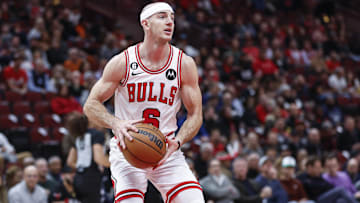 Dec 7, 2022; Chicago, Illinois, USA; Chicago Bulls guard Alex Caruso (6) looks to pass the ball against the Washington Wizards during the first half at United Center. Mandatory Credit: Kamil Krzaczynski-Imagn Images
