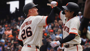 Apr 24, 2025; San Francisco, California, USA; San Francisco Giants third baseman Matt Chapman (26) celebrates with center fielder Jung Hoo Lee (51) after batting him in on a two-run home run against the Milwaukee Brewers during the fifth inning at Oracle Park.