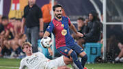 Barcelona's Ilkay Gundogan battles Real Madrid defender Nico Paz during an international friendly at MetLife Stadium.