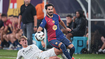 Barcelona's Ilkay Gundogan battles Real Madrid defender Nico Paz during an international friendly at MetLife Stadium.