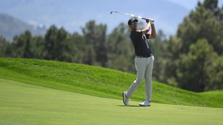 Aug 22, 2024; Castle Rock, Colorado, USA; Adam Scott hits his second shot on the 18th hole during the first round of the BMW Championship golf tournament at Castle Pines Golf Club. Mandatory Credit: Christopher Hanewinckel-USA TODAY Sports