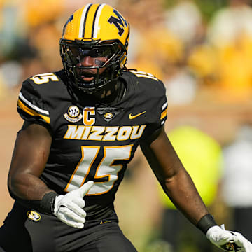 Oct 19, 2024; Columbia, Missouri, USA; Missouri Tigers defensive end Johnny Walker Jr. (15) defends Auburn Tigers tight end Micah Riley (84) during the second half at Faurot Field at Memorial Stadium. Mandatory Credit: Jay Biggerstaff-Imagn Images