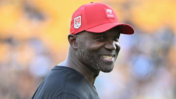 Aug 16, 2025; Pittsburgh, Pennsylvania, USA; TTampa Bay Buccaneers head coach Todd Bowles () warms up for a game against the Pittsburgh Steelers at Acrisure Stadium. Mandatory Credit: Barry Reeger-Imagn Images