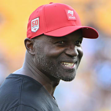 Aug 16, 2025; Pittsburgh, Pennsylvania, USA; TTampa Bay Buccaneers head coach Todd Bowles () warms up for a game against the Pittsburgh Steelers at Acrisure Stadium. Mandatory Credit: Barry Reeger-Imagn Images