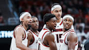 Louisville Cardinals guard Kobe Rodgers (11) reacts after getting called for a foul as he and his teammates huddle during the Cards' 90-82 loss to Kansas during an exhibition game at the KFC Yum! Center in Louisville, Kentucky Friday, October 24, 2025.