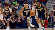 Nov 19, 2025; New Orleans, Louisiana, USA;  New Orleans Pelicans guard Jeremiah Fears (0) brings the ball up court against the Denver Nuggets during the second half  at Smoothie King Center. Mandatory Credit: Stephen Lew-Imagn Images