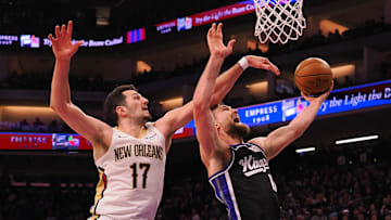 Feb 8, 2025; Sacramento, California, USA; New Orleans Pelicans forward Karlo Matkovic (17) fouls Sacramento Kings center Domantas Sabonis (11) during the second quarter at Golden 1 Center. Mandatory Credit: Kelley L Cox-Imagn Images