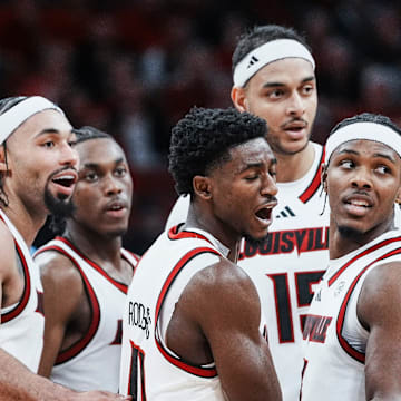 Louisville Cardinals guard Kobe Rodgers (11) reacts after getting called for a foul as he and his teammates huddle during the Cards' 90-82 loss to Kansas during an exhibition game at the KFC Yum! Center in Louisville, Kentucky Friday, October 24, 2025.