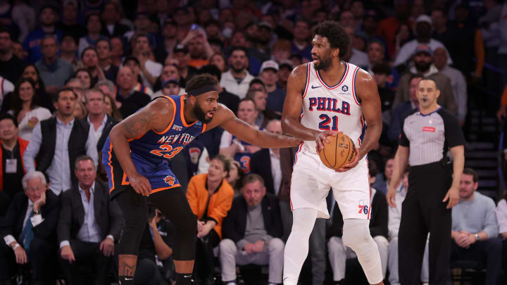 Apr 30, 2024; New York, New York, USA; Philadelphia 76ers center Joel Embiid (21) controls the ball against New York Knicks center Mitchell Robinson (23) during the fourth quarter of game 5 of the first round of the 2024 NBA playoffs at Madison Square Garden. Mandatory Credit: Brad Penner-USA TODAY Sports