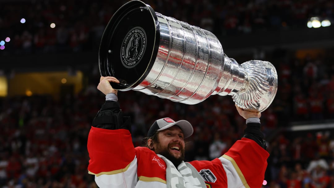 Jun 24, 2024; Sunrise, Florida, USA; Florida Panthers goaltender Sergei Bobrovsky (72) hoists the Stanley Cup  after defeating the Edmonton Oilers in game seven of the 2024 Stanley Cup Final at Amerant Bank Arena. Mandatory Credit: Sam Navarro-USA TODAY Sports