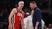 Mar 28, 2025; Atlanta, GA, USA; Mississippi Rebels guard Sean Pedulla (3) talks to head coach Chris Beard in the first half of a South Regional semifinal of the 2025 NCAA tournament against the Michigan State Spartans at State Farm Arena. Mandatory Credit: Brett Davis-Imagn Images