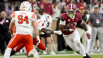 Nov 16, 2024; Tuscaloosa, AL, USA; Alabama Crimson Tide running back Daniel Hill (20) cuts back between Mercer Bears linebacker Marques Thomas (6) and defensive lineman Andrew Zock (94) at Bryant-Denny Stadium. Mandatory Credit: Gary Cosby Jr.-Imagn Images