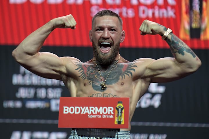 Conor McGregor reacts during weigh ins for UFC 264 at T-Mobile Arena.