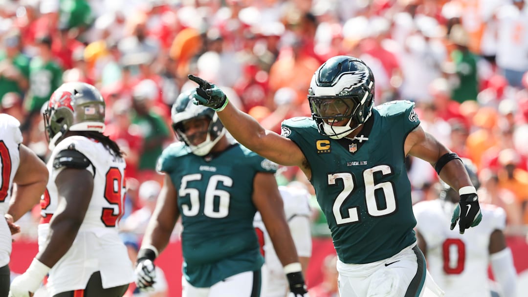 Sep 28, 2025; Tampa, Florida, USA; Philadelphia Eagles running back Saquon Barkley (26) celebrates a touchdown during the second half against the Tampa Bay Buccaneers at Raymond James Stadium. Mandatory Credit: Kim Klement Neitzel-Imagn Images
