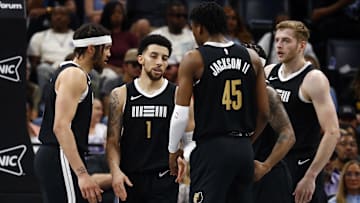 Apr 14, 2024; Memphis, Tennessee, USA; Memphis Grizzlies forward Timmy Allen (0) and forward GG Jackson (45) react with guard Scotty Pippen Jr. (1) during the first half against the Denver Nuggets at FedExForum. 