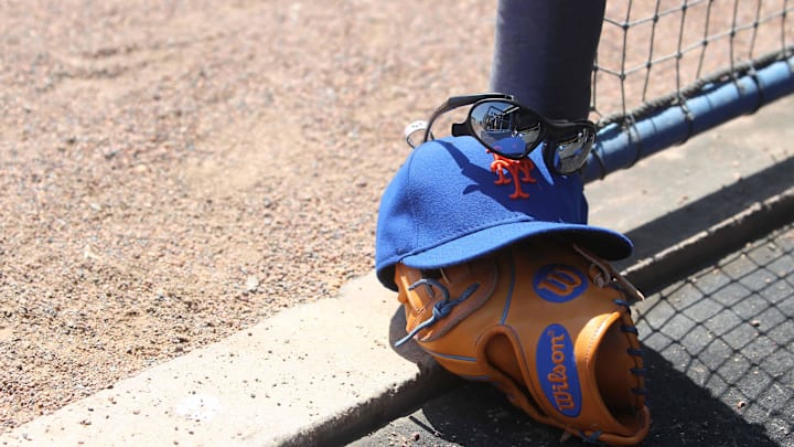 April 4, 2012; Tampa, FL, USA; New York Mets third baseman David Wright (not pictured) glove, hat and sunglasses lay in the dugout during the spring training game against the New York Yankees at George M. Steinbrenner Field. Mandatory Credit: Kim Klement-Imagn Images