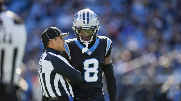 Jan 7, 2024; Charlotte, North Carolina, USA; Carolina Panthers cornerback Jaycee Horn (8) talks with umpire Tra Blake (33) during the first quarter against the Tampa Bay Buccaneers at Bank of America Stadium.