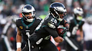 Nov 28, 2025; Philadelphia, Pennsylvania, USA; Philadelphia Eagles quarterback Jalen Hurts (1) hands the ball to Philadelphia Eagles running back Saquon Barkley (26) against the Chicago Bears during the second quarter of the game at Lincoln Financial Field. Mandatory Credit: Bill Streicher-Imagn Images