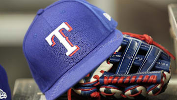 Jul 26, 2024; Toronto, Ontario, CAN; A hat and glove of a Texas Rangers player during a game against the Toronto Blue Jays at Rogers Centre. 
