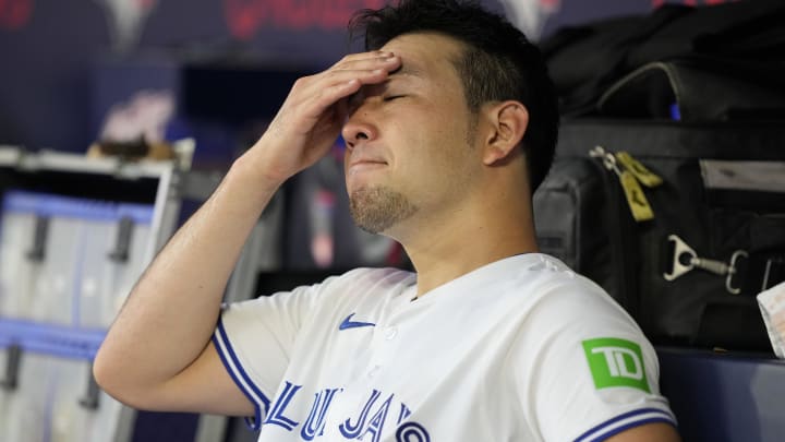 Jul 26, 2024; Toronto, Ontario, CAN; Toronto Blue Jays starting pitcher Yusei Kikuchi (16) in the dug out during the second inning against the Texas Rangers at Rogers Centre. Mandatory Credit: John E. Sokolowski-USA TODAY Sports