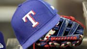 A hat and glove of a Texas Rangers player during a game against the Toronto Blue Jays at Rogers Centre. 