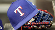 A hat and glove of a Texas Rangers player during a game against the Toronto Blue Jays at Rogers Centre. 