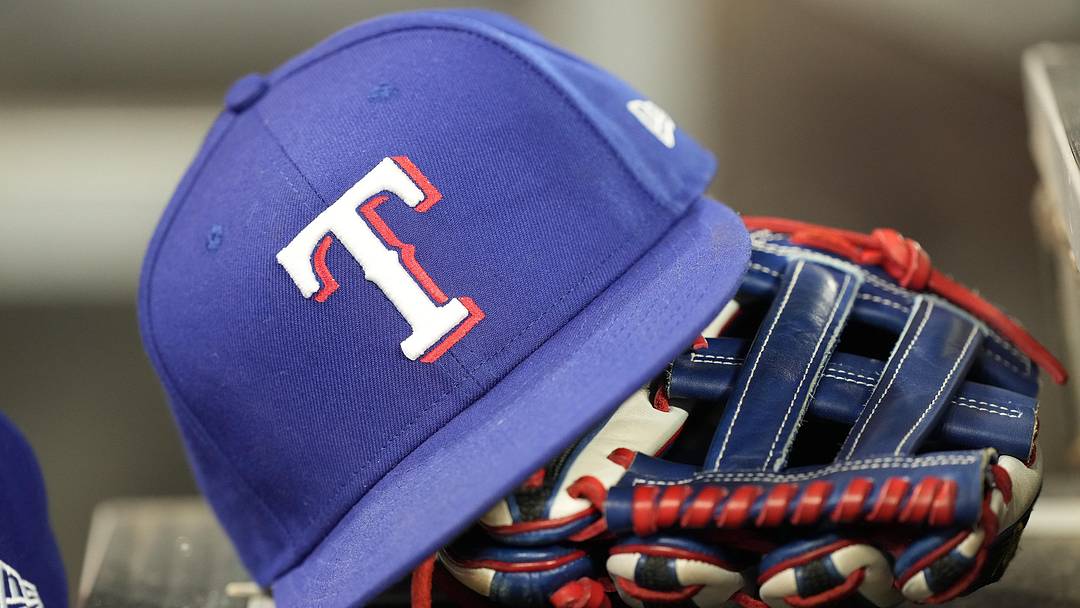 A hat and glove of a Texas Rangers player 