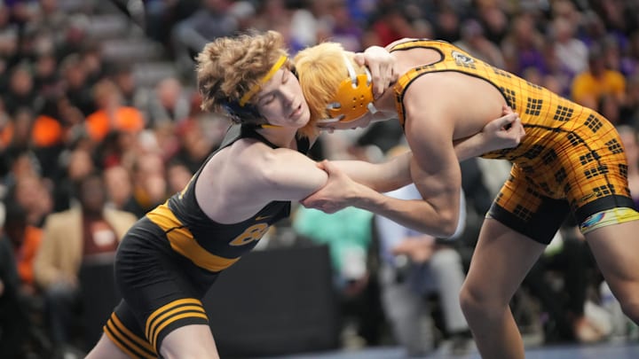 Carter Pearson (right) of Southeast Polk helped the Rams take home the Class 3A state duals title Saturday.