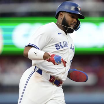 Jul 26, 2024; Toronto, Ontario, CAN; Toronto Blue Jays first baseman Vladimir Guerrero Jr. (27) runs to home to score on a double hit by second baseman Spencer Horwitz (not pictured) during first inning against the Texas Rangers at Rogers Centre.