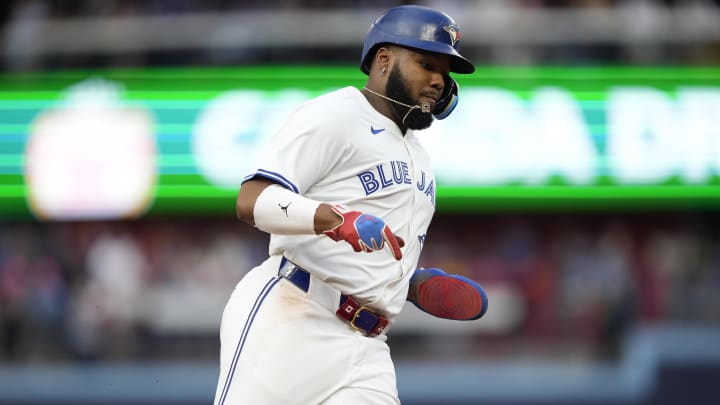 Jul 26, 2024; Toronto, Ontario, CAN; Toronto Blue Jays first baseman Vladimir Guerrero Jr. (27) runs to home to score on a double hit by second baseman Spencer Horwitz (not pictured) during first inning against the Texas Rangers at Rogers Centre.