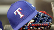 Jul 26, 2024; Toronto, Ontario, CAN; A hat and glove of a Texas Rangers player during a game against the Toronto Blue Jays at Rogers Centre. 