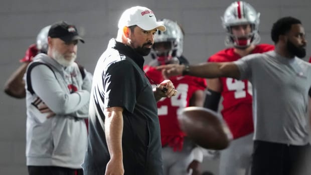 Head coach watches in practice.