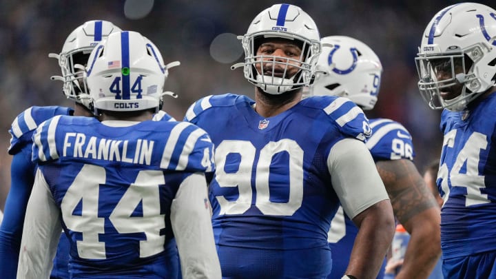 Indianapolis Colts defensive tackle Grover Stewart (90) stands in the huddle Sunday, Oct. 30, 2022, during a game against the Washington Commanders at Indianapolis Colts at Lucas Oil Stadium in Indianapolis.