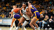 Iowa forward Hannah Stuelke (45) drives to the basket defended by Ashland forward Katelyn Harabedian (7) Oct. 30, 2025 during an exhibition game at Carver-Hawkeye Arena in Iowa City, Iowa.