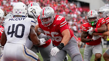 Aug 31, 2024; Columbus, OH, USA; Ohio State Buckeyes offensive lineman Seth McLaughlin (56) blocks Akron Zips linebacker Bryan McCoy (40) as running back Quinshon Judkins (1) runs the ball into the endzone during the NCAA football game at Ohio Stadium. Ohio State won 52-6.