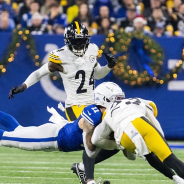 Dec 16, 2023; Indianapolis, Indiana, USA; Indianapolis Colts wide receiver Michael Pittman Jr. (11) dives for a catch while Pittsburgh Steelers safety Damontae Kazee (23) defends in the first half at Lucas Oil Stadium. Mandatory Credit: Trevor Ruszkowski-USA TODAY Sports